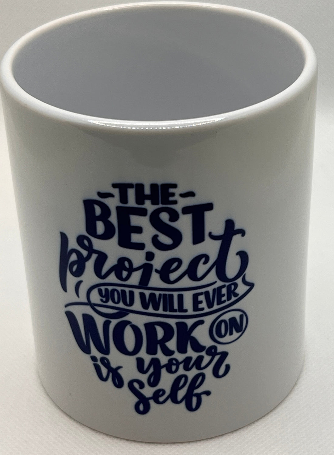 Mug with "The Best project you will ever work on is your self" Graphic
